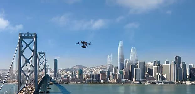Hover drone in flight over San Francisco Bay with the Bay Bridge and downtown skyline